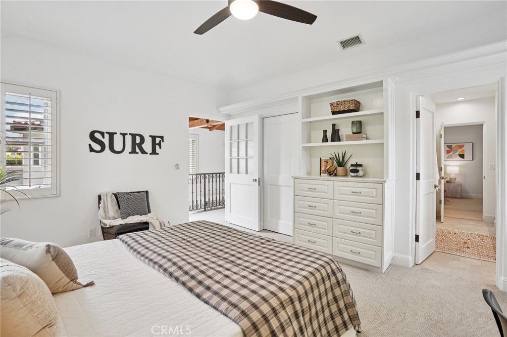 587 26th Street Manhattan Beach, CA 90266 - Photo 32 of 67 a bedroom with a bed and a cabinets