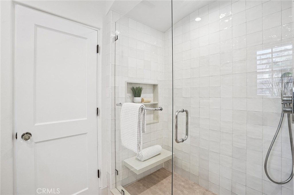 587 26th Street Manhattan Beach, CA 90266 - Photo 41 of 67 a bathroom with a shower and a glass door