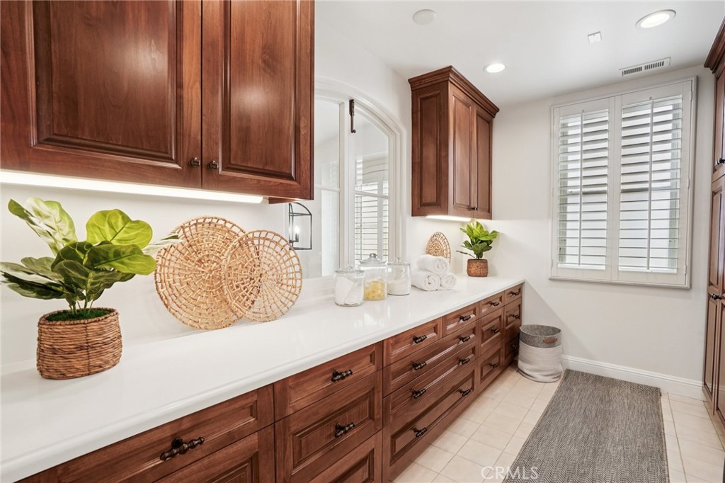 587 26th Street Manhattan Beach, CA 90266 - Photo 43 of 67 a bathroom with a granite countertop sink a potted plant and a window