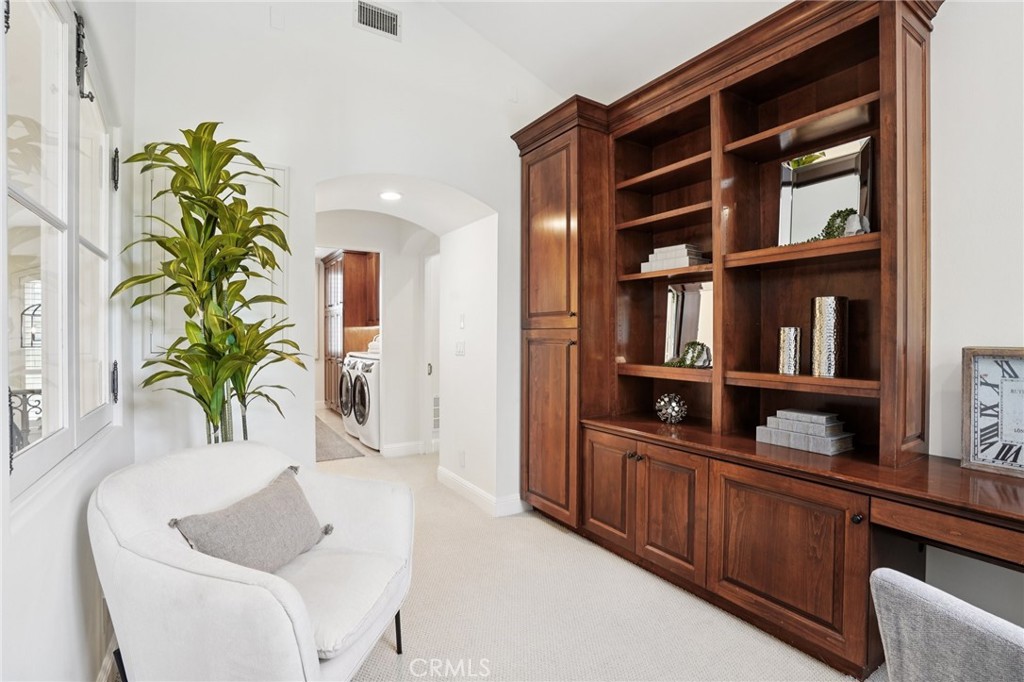 587 26th Street Manhattan Beach, CA 90266 - Photo 47 of 67 a living room with furniture and a potted plant