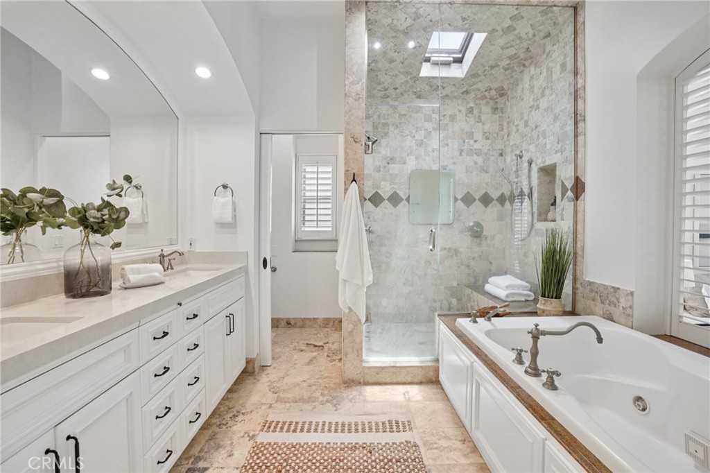 587 26th Street Manhattan Beach, CA 90266 - Photo 48 of 67 a bathroom with a tub sink and mirror