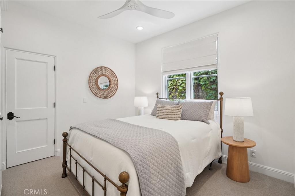 587 26th Street Manhattan Beach, CA 90266 - Photo 54 of 67 a bedroom with a bed and a lamp