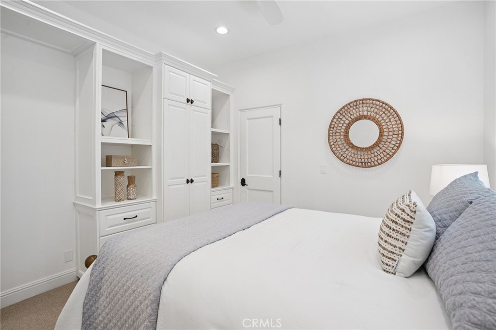 587 26th Street Manhattan Beach, CA 90266 - Photo 55 of 67 a bedroom with a bed and a window
