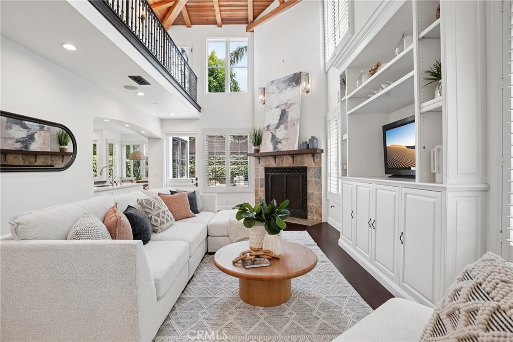 587 26th Street Manhattan Beach, CA 90266 - Photo 9 of 67 a living room with furniture a flat screen tv and a fireplace