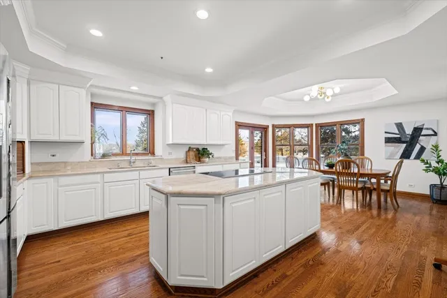 a kitchen with sink stove and refrigerator