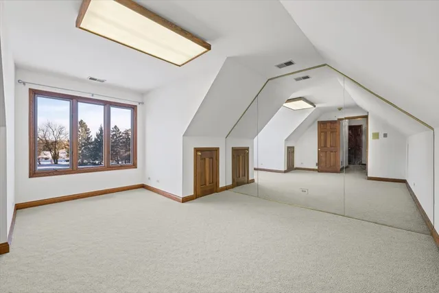 a bedroom with bed and window