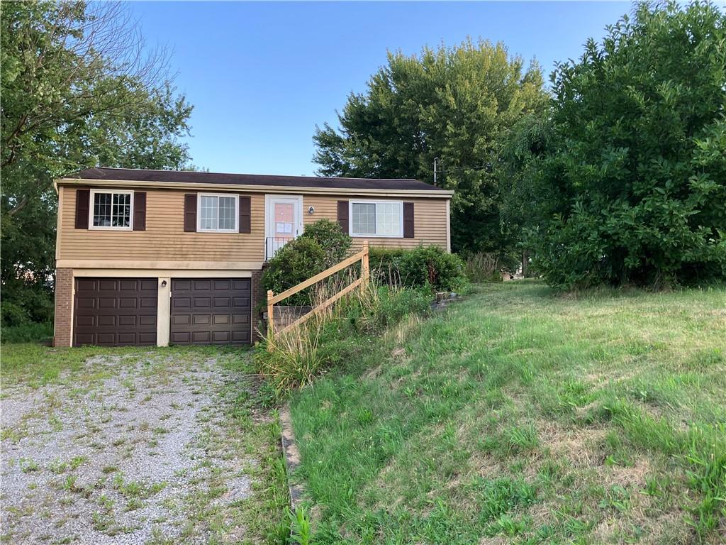 54 Bock Lane Baden, PA 15005 - Photo 1 of 25 a front view of a house with yard and trees