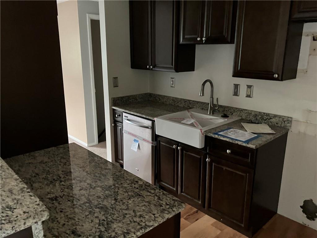 54 Bock Lane Baden, PA 15005 - Photo 13 of 25 a kitchen with a sink stove and microwave
