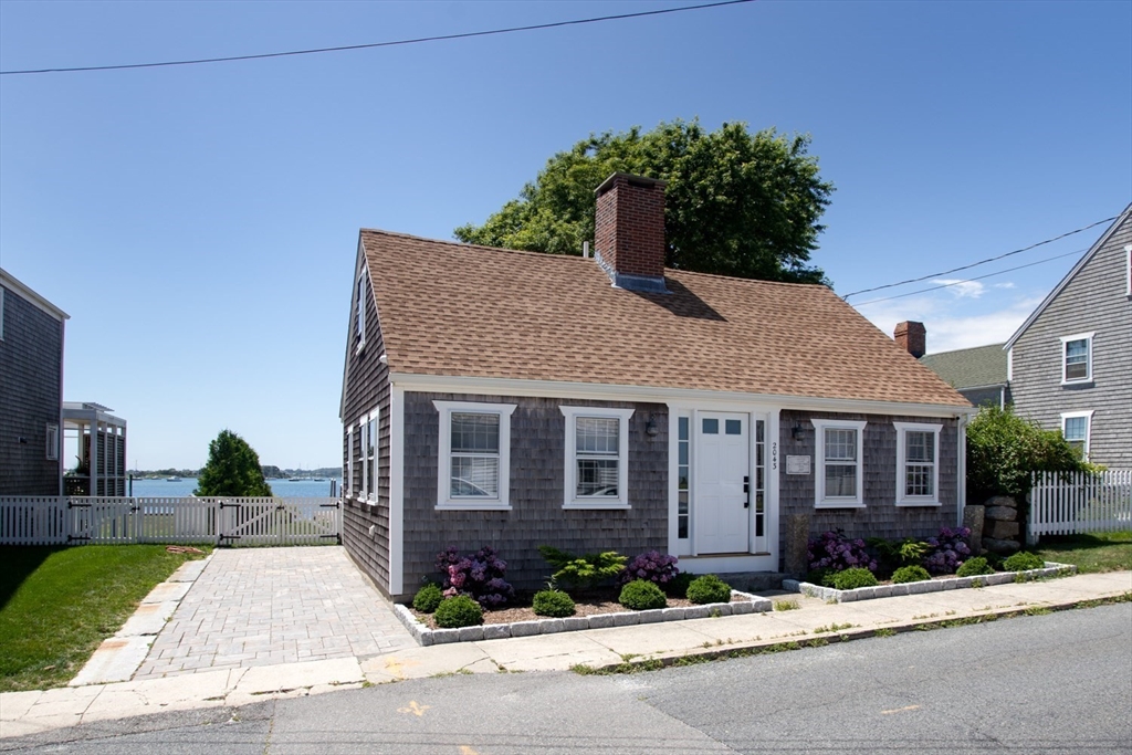2043 Main Road Westport, MA 02791 - Photo 1 of 42 a front view of a house with a yard and outdoor seating
