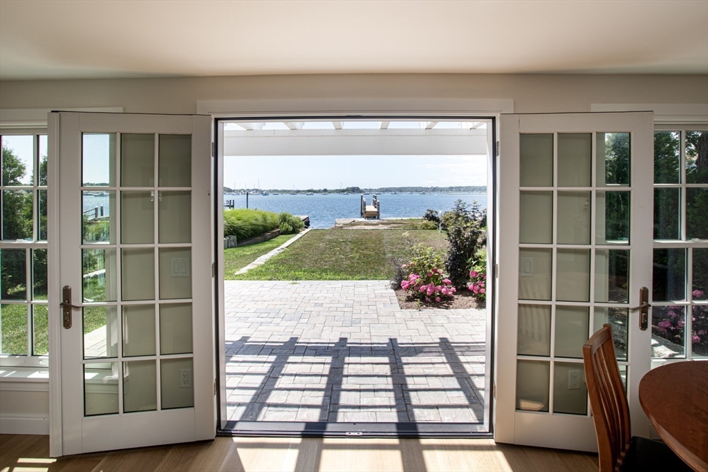2043 Main Road Westport, MA 02791 - Photo 13 of 42 a view of a door and a potted plant on a table