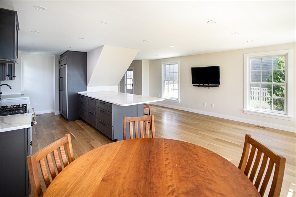 2043 Main Road Westport, MA 02791 - Photo 15 of 42 a spacious bedroom with a bed and a flat screen tv