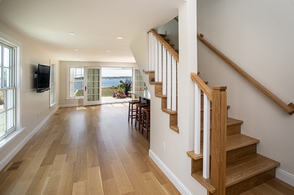 2043 Main Road Westport, MA 02791 - Photo 16 of 42 a view of a hallway with wooden floor and staircase