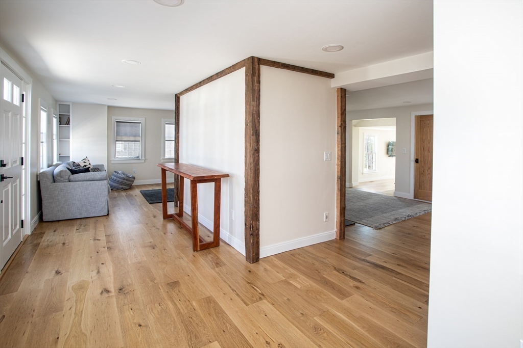 2043 Main Road Westport, MA 02791 - Photo 22 of 42 a living room with furniture and a wooden floor