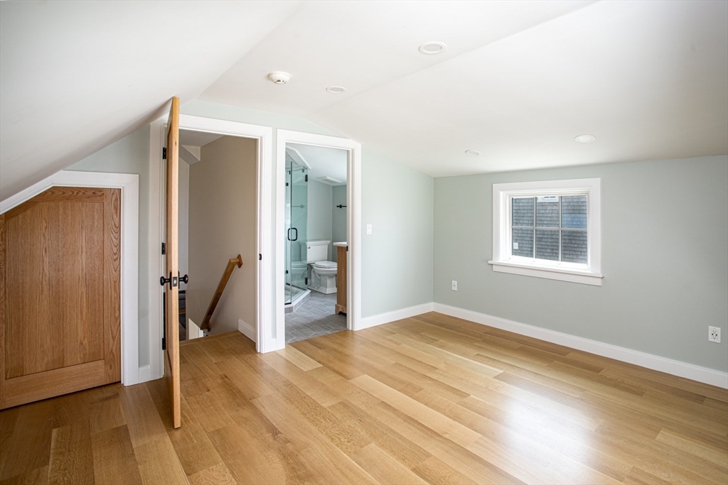 2043 Main Road Westport, MA 02791 - Photo 27 of 42 a view of a room with wooden floor ceiling fan and windows