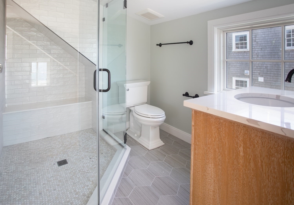 2043 Main Road Westport, MA 02791 - Photo 28 of 42 a bathroom with a sink a toilet and shower