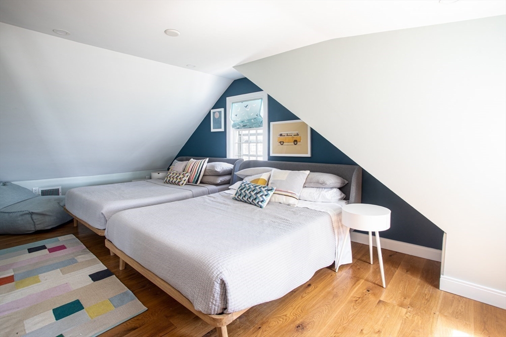 2043 Main Road Westport, MA 02791 - Photo 31 of 42 a bedroom with a bed and a table in it
