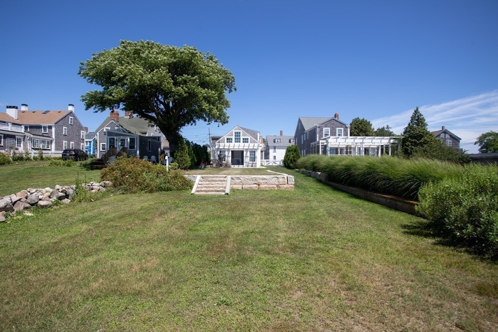 2043 Main Road Westport, MA 02791 - Photo 39 of 42 a front view of a house with a yard and garage