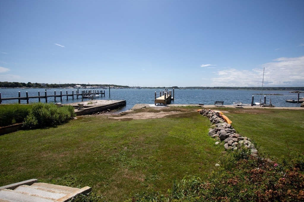 2043 Main Road Westport, MA 02791 - Photo 40 of 42 a view of a golf course with a lake view