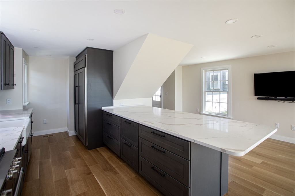 2043 Main Road Westport, MA 02791 - Photo 10 of 42 a kitchen with stainless steel appliances granite countertop a sink stove and refrigerator
