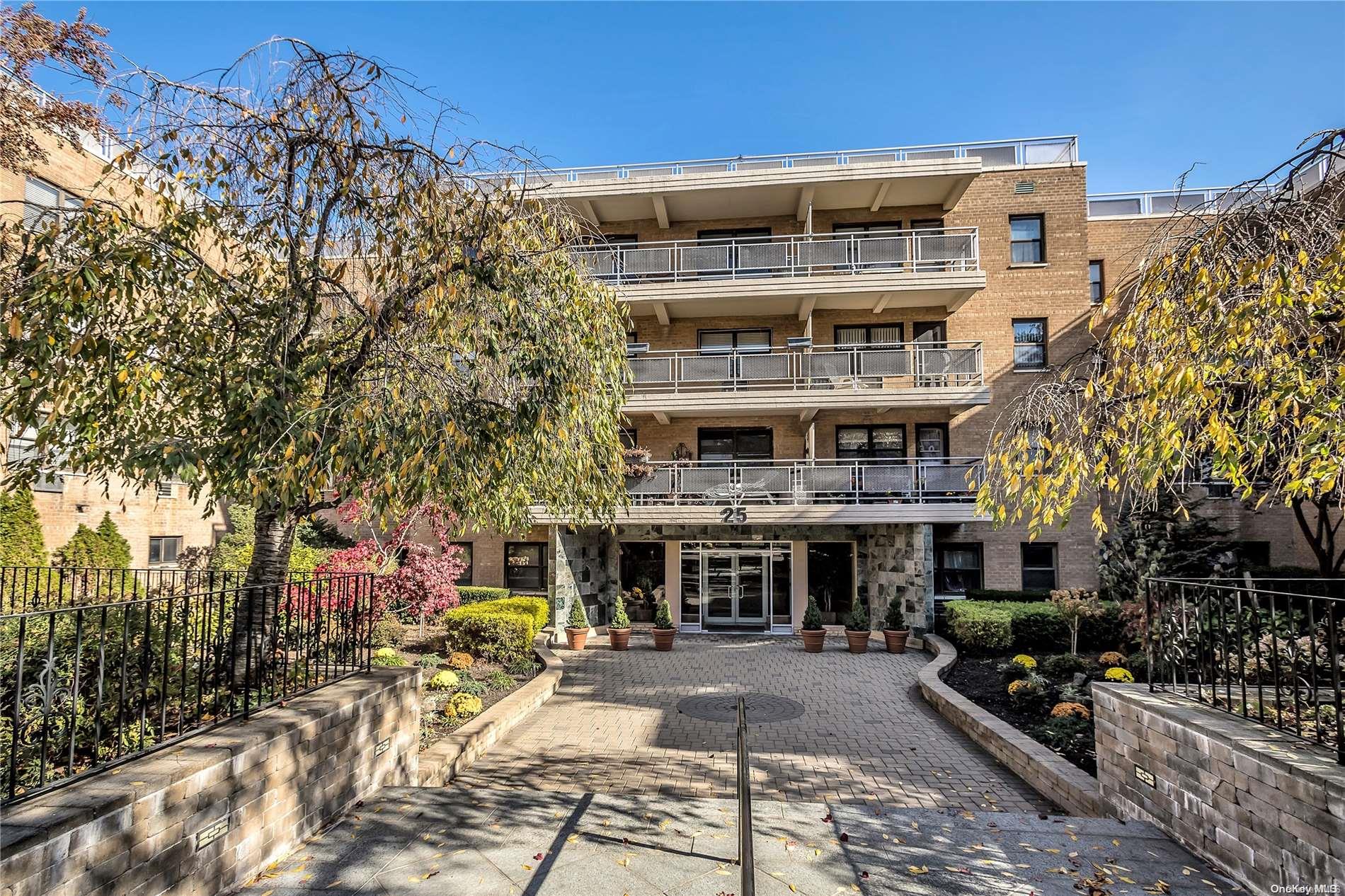 25 Park Place, Unit 1 EE Great Neck, NY 11021 - Photo 1 of 1 a front view of a building with outdoor space
