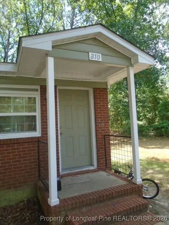 a view of a house with a small yard