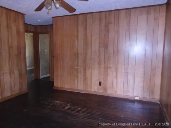 a view of a room with wooden walls