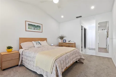 a bedroom with bed and a couch