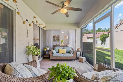 a bedroom with furniture and a potted plant