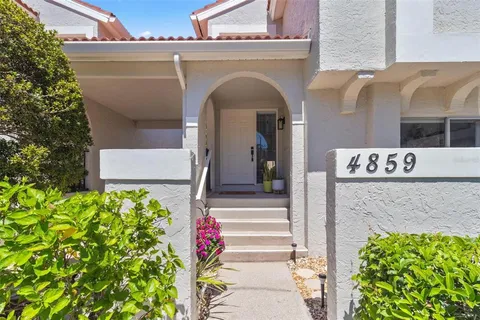 a front view of a building with flowers