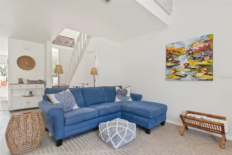 a living room with furniture and a rug