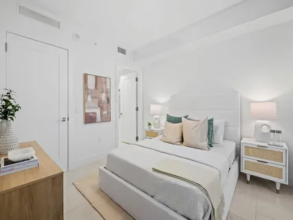 a bedroom with a bed and a table