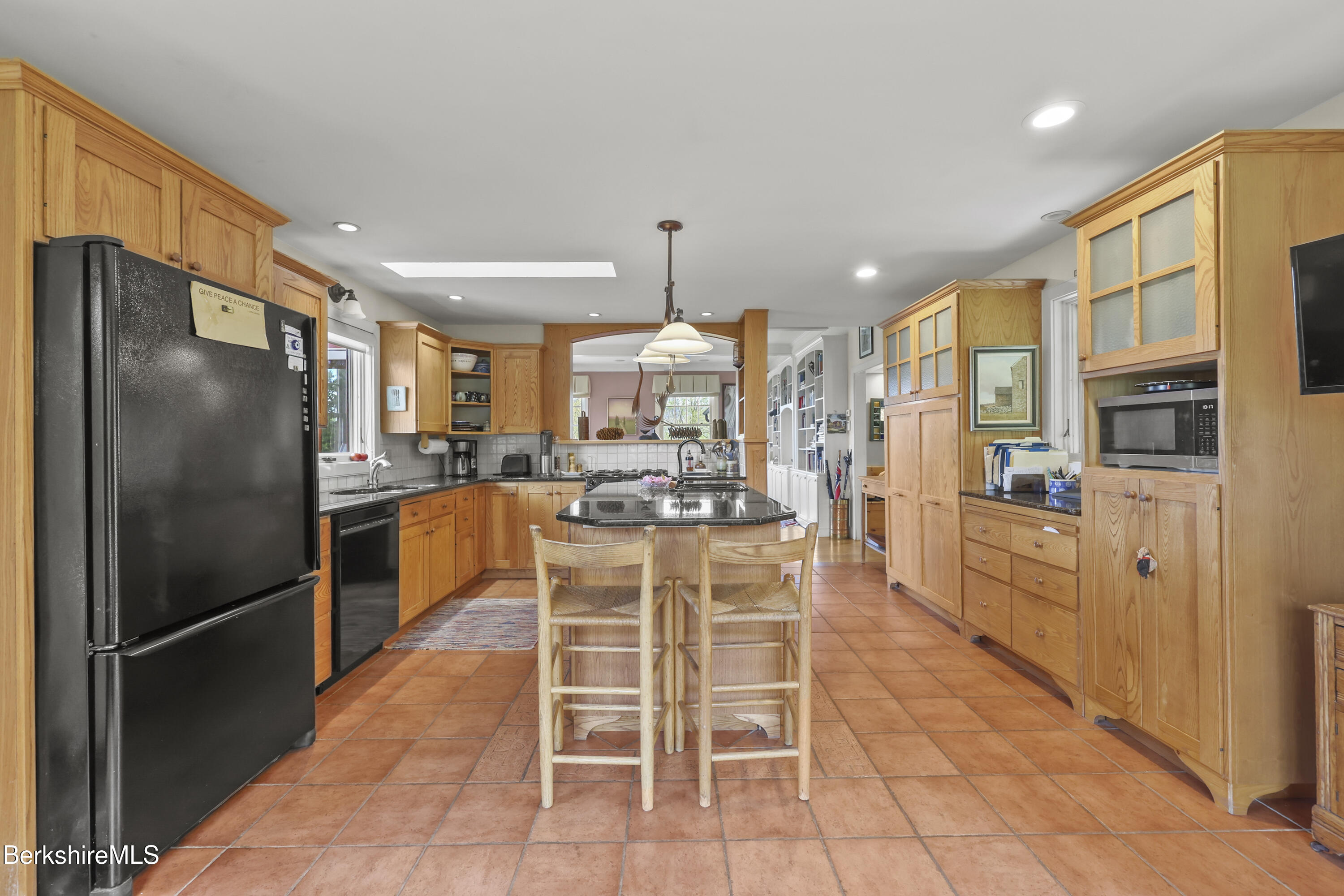 821 Pattison Road North Adams, MA 01247 - Photo 20 of 68 a kitchen with stainless steel appliances kitchen island granite countertop a refrigerator and cabinets