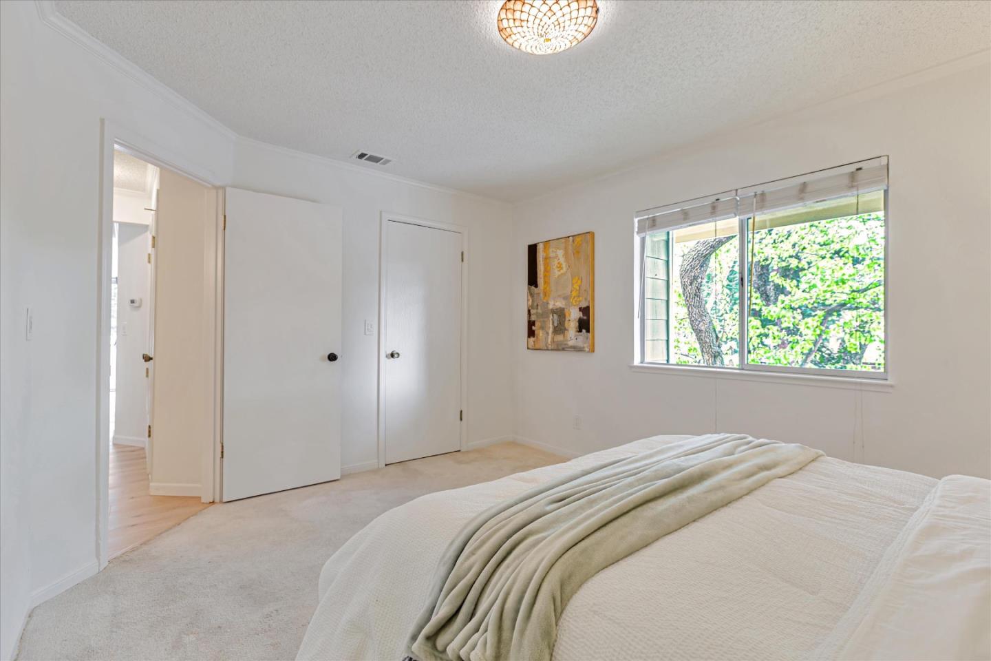 2575 Oak Road, Unit B Walnut Creek, CA 94597 - Photo 11 of 20 a bedroom with a bed and a window
