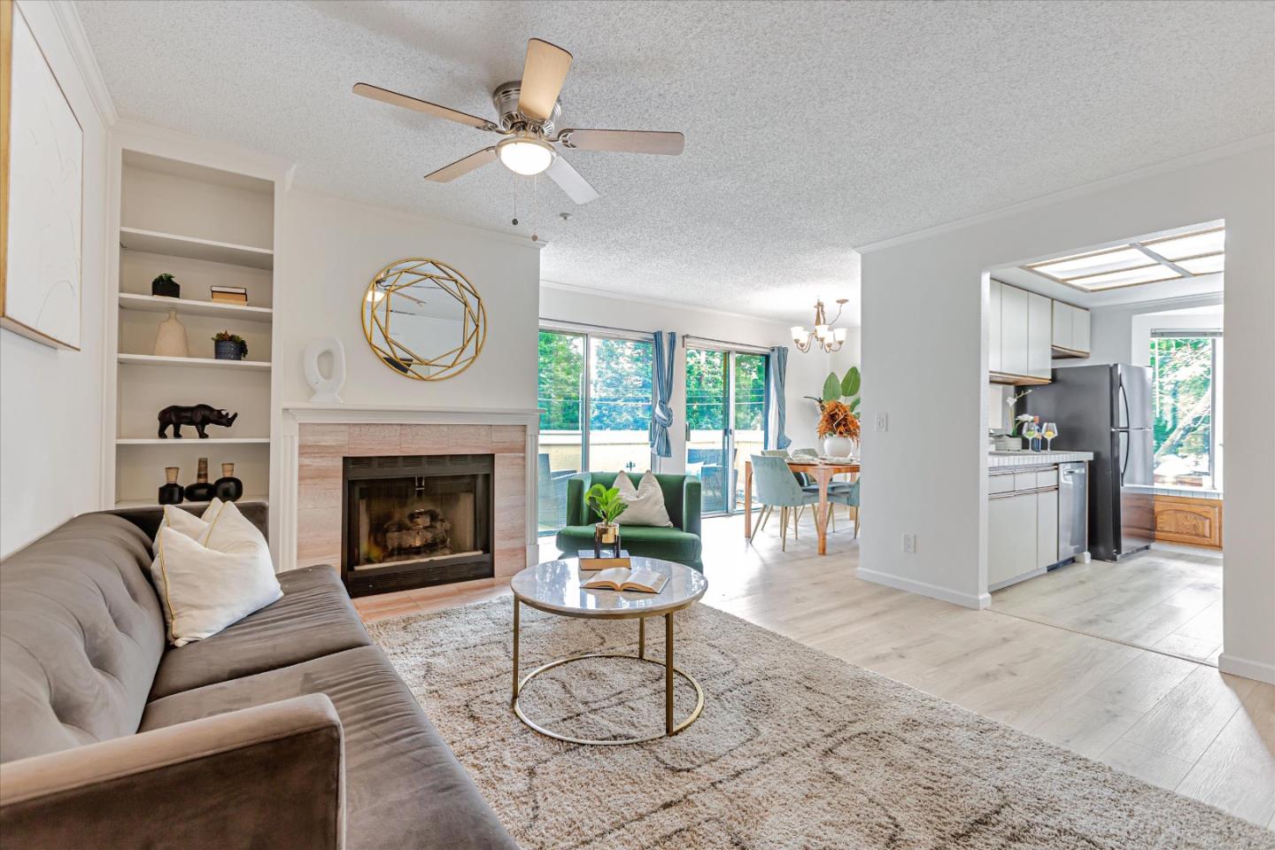 2575 Oak Road, Unit B Walnut Creek, CA 94597 - Photo 3 of 20 a living room with furniture a clock and a fireplace