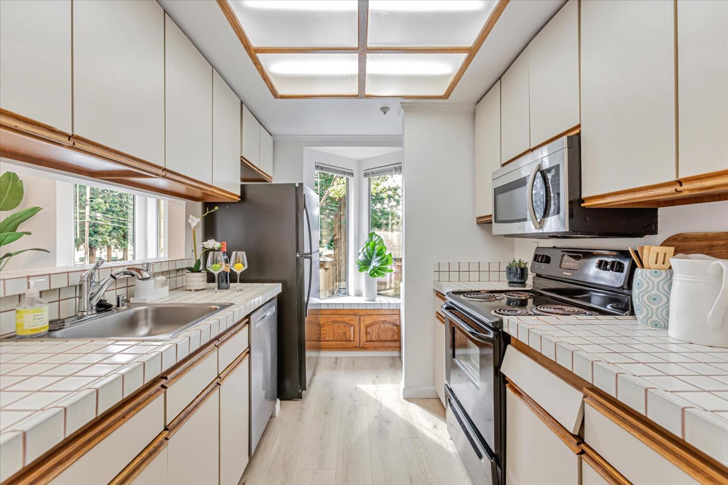 2575 Oak Road, Unit B Walnut Creek, CA 94597 - Photo 5 of 20 a kitchen with a sink stove and cabinets