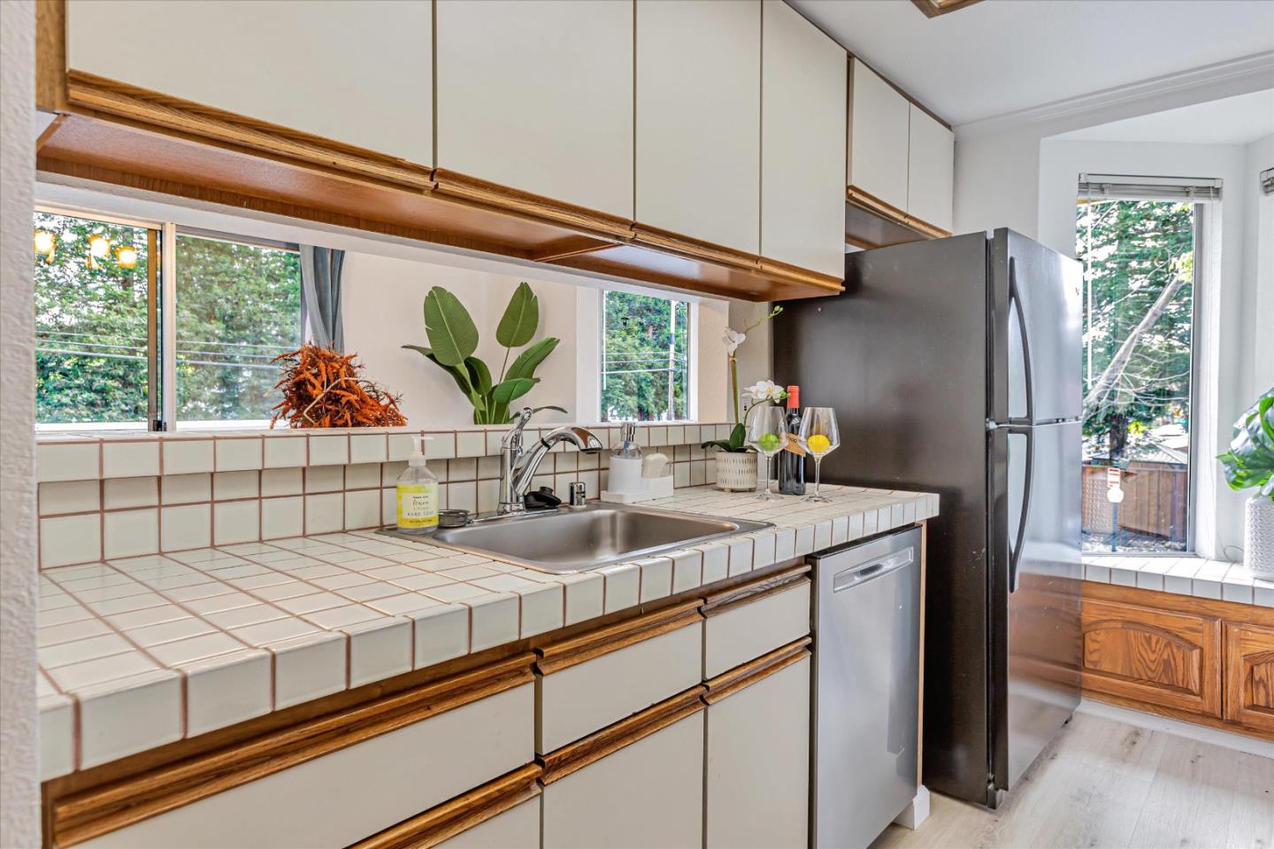 2575 Oak Road, Unit B Walnut Creek, CA 94597 - Photo 6 of 20 a kitchen with stainless steel appliances granite countertop a sink and a refrigerator