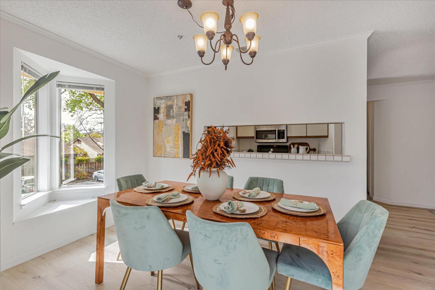 2575 Oak Road, Unit B Walnut Creek, CA 94597 - Photo 7 of 20 a view of a dining room with furniture wooden floor and chandelier
