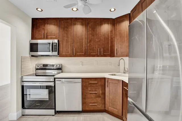 a kitchen with a stove and a microwave