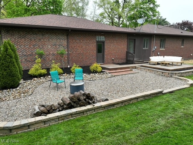 2530 Holgate Road Akron, OH 44313 - Photo 30 of 31 Back of property featuring a patio, brick siding, and a yard