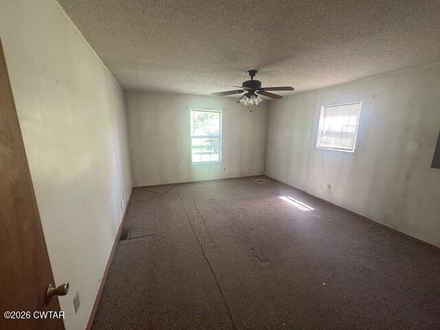 662 Blue Lane Huntingdon, TN 38344 - Photo 12 of 16 an empty room with windows and fan