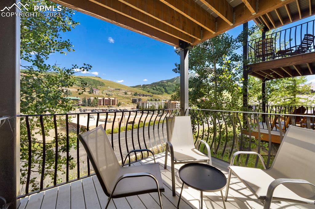 651 Gothic Road, Unit 301 Crested Butte, CO 81225 - Photo 15 of 24 a balcony with table and chairs