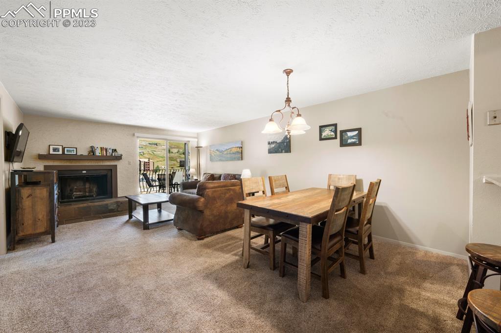 651 Gothic Road, Unit 301 Crested Butte, CO 81225 - Photo 9 of 24 a view of a dining room with furniture