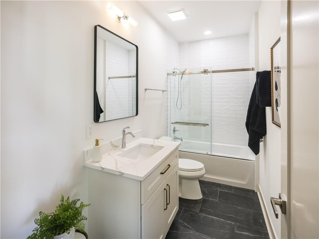 909 Rickenbach Street Pittsburgh, PA 15212 - Photo 16 of 23 a bathroom with a sink toilet and shower