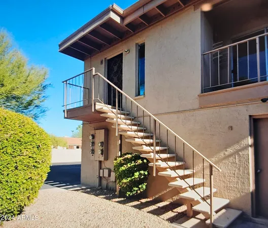 a front view of a house with wooden stairs