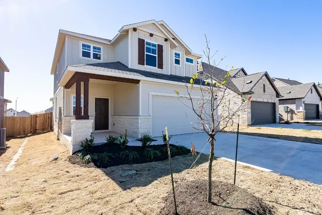 a front view of a house with large windows