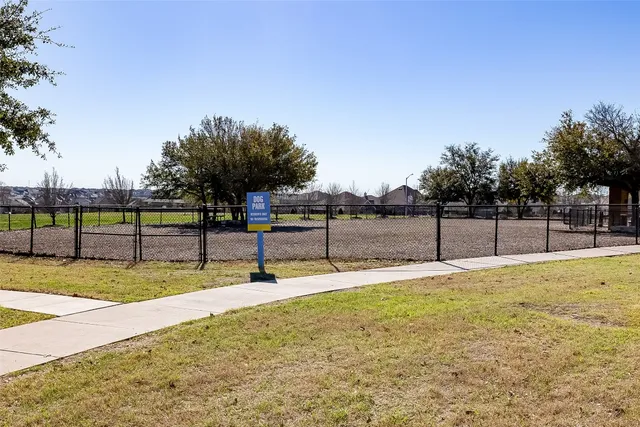 a view of swimming pool with trees in the background