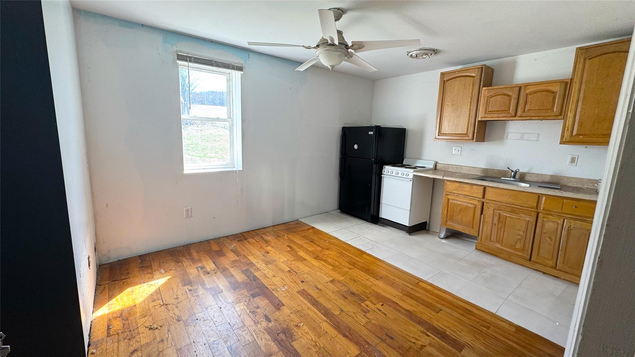 892 Bowbell Road Greene, NY 13778 - Photo 29 of 35 a view of a kitchen with a sink dishwasher and a microwave oven