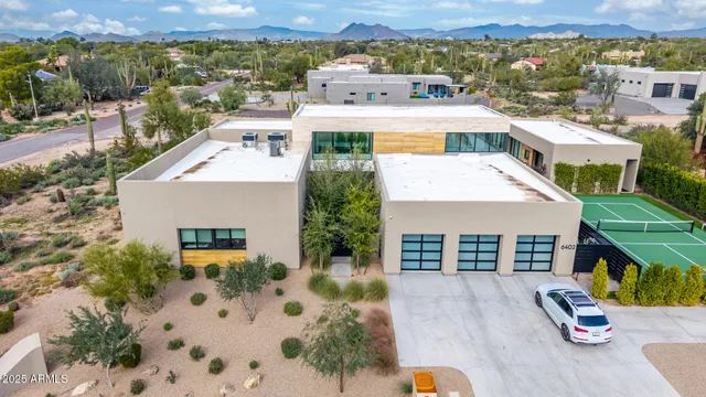 an aerial view of residential houses with outdoor space