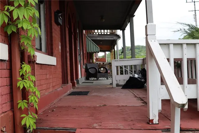 front view of a house with a small deck
