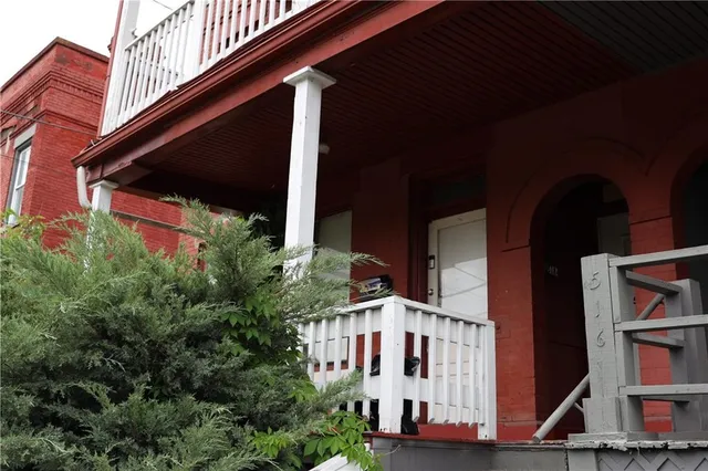 a kitchen with a refrigerator and cabinets